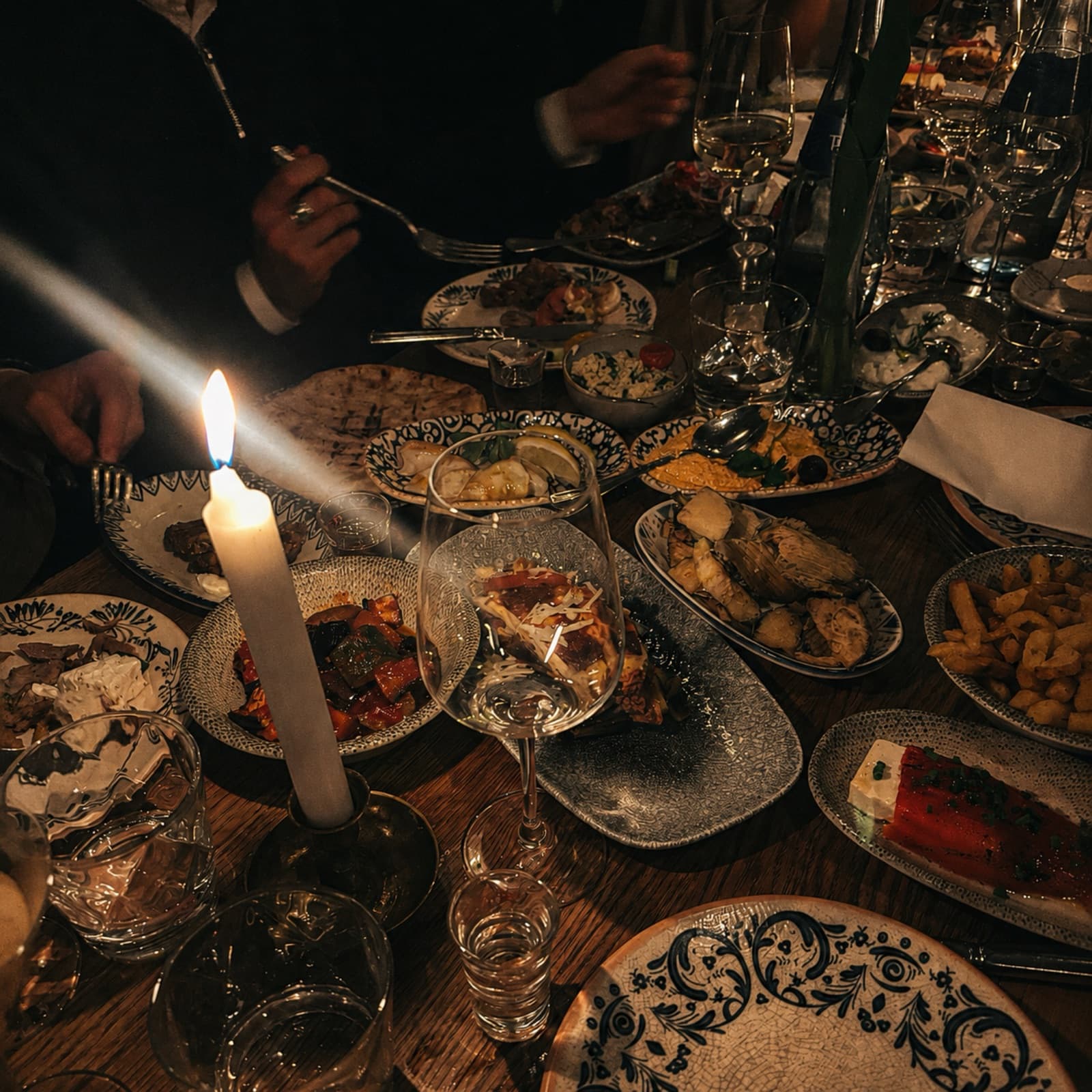 Divine Honesty album cover: a candlelit dinner table, laden and faceless